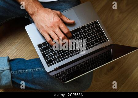 Freelancer using laptop at home Stock Photo