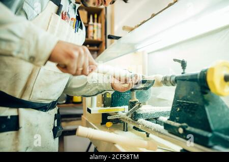 Wood turning on a lathe at a demonstration on workshop Stock Photo