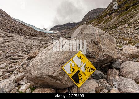 Warning sign at the end of th Jostedalsbreen Glacier warns of the dangers near Stryn, Norway Stock Photo