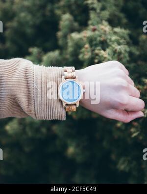 Traveler checking time on wristwatch Stock Photo