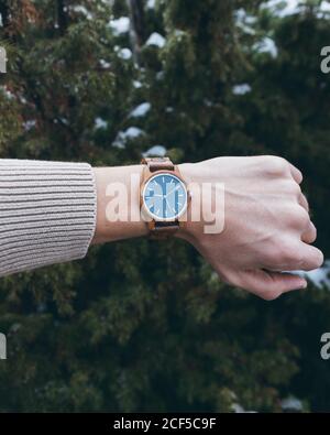 Traveler checking time on wristwatch Stock Photo