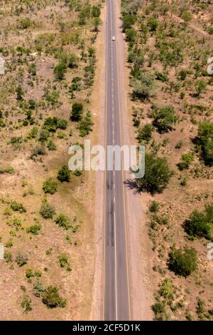 Aerial view of road near Victoria Falls flying over by helicopter