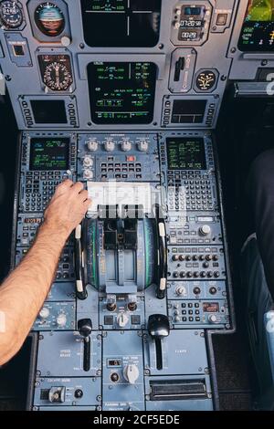 Pilots working in cockpit during flight Stock Photo