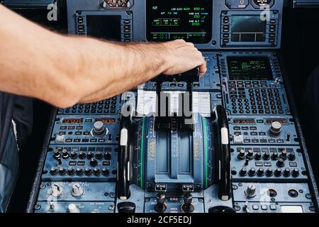 Pilot operating airplane in cockpit Stock Photo
