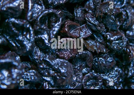 Dry plums or prunes fruit can use as background. Top views, close-up Stock Photo