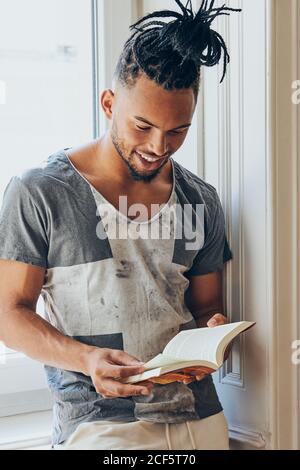 A Young Black Guy with Mohawk Hair is Standing by a Rocky Fence, Relaxing  Stock Photo - Image of funky, fashionable: 237734942