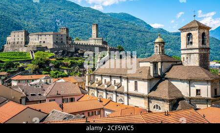 Scenic cityscape of Bellinzona with Castelgrande castle and Chiesa Collegiata dei Santi Pietro e Stefano church in Ticino Switzerland Stock Photo
