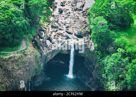Hawaii Rainbow Falls waterfall near Hilo, Big Island. USA travel. Aerial top view from helicopter. Stock Photo