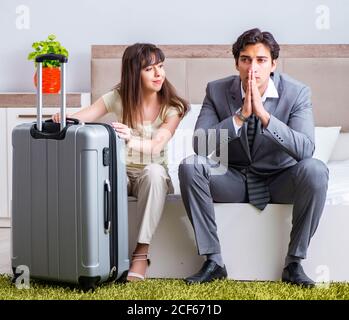 The wife seeing her husband off to business trip Stock Photo