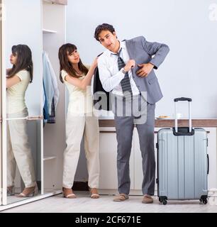 The wife seeing her husband off to business trip Stock Photo