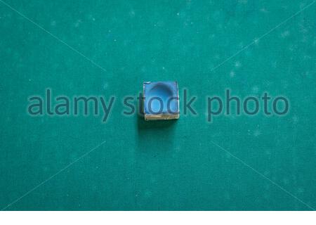 A snooker chalk on a pool table Stock Photo