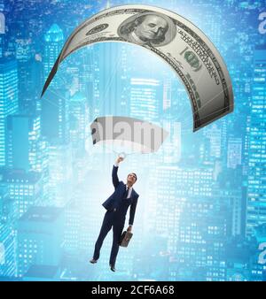 The businessman in golden parachute concept Stock Photo