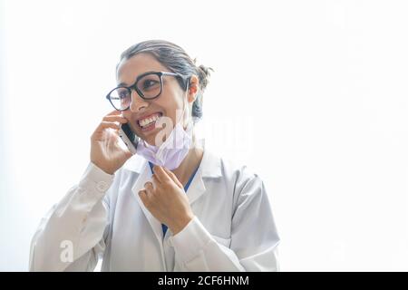 female dentist talking on the phone Stock Photo