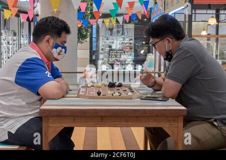 Thailand chess. Men playing Makruk, which is a Thailand version of chess. Southeast Asia Stock Photo