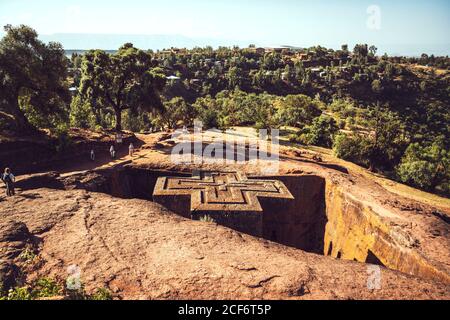 Lalibela, Ethiopia - November 04, 2018: Majestic landscape of rock-hewn church in shape of cross in monolithic cliff, Lalibela, Ethiopia Stock Photo