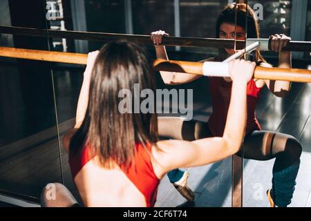 Concentrated dancer training with barre Stock Photo