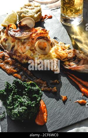 Sea delicacy of baked fish in restaurant Stock Photo