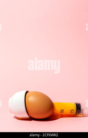 Egg with syringe in eggcup Stock Photo
