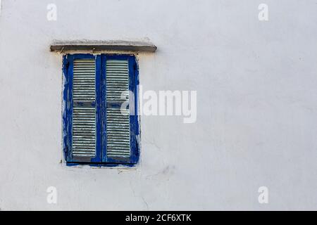 Blue window shutters on white concrete wall of house in Tangier, Morocco Stock Photo