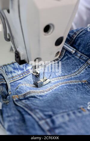 Employee working on an industrial sewing machine Stock Photo - Alamy