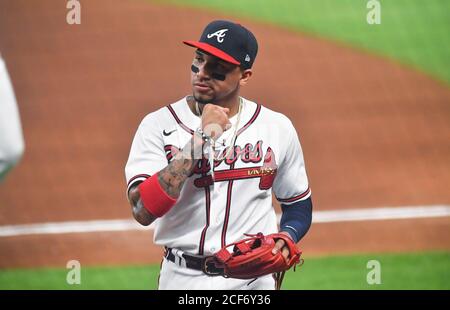 Philadelphia Phillies third baseman Johan Camargo holds his glove out after  catching a line out by Texas Rangers' Adolis Garcia in the fourth inning of  a baseball game, Tuesday, June 21, 2022