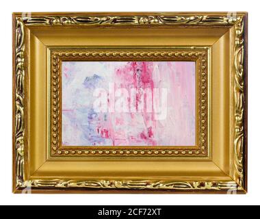 White canvas is grounded of  red and blue colosr by oil  paint in golden frame. Studio macro isolated  shot Stock Photo