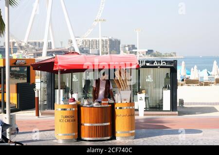 Dubai, United Arab Emirates - July 31, 2020: Street kiosk selling Turkish ice cream near the city recreation area and the central beach