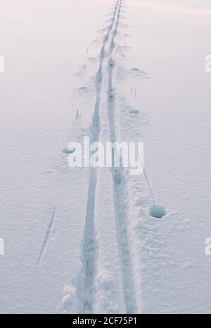 Traces in the snow. Winter background Stock Photo - Alamy