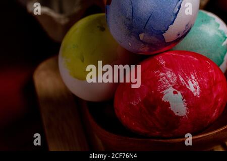 Set of painted Easter eggs in container on table Stock Photo