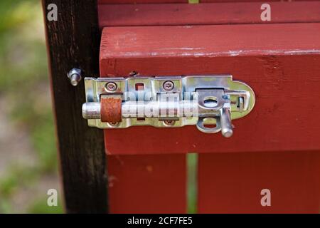 a fastener mounted on the gate Stock Photo