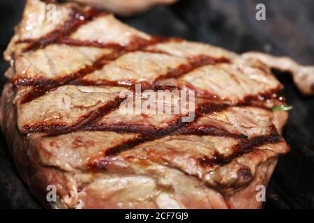 Steak on the grill with a lozenge pattern Stock Photo