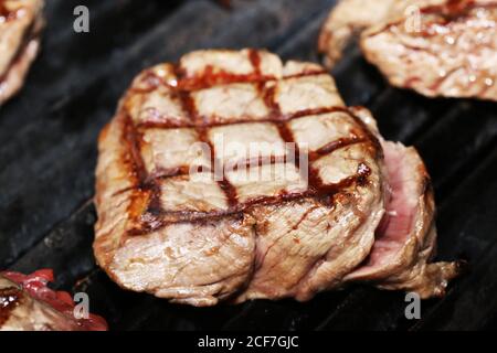 Steak on the grill with a lozenge pattern Stock Photo