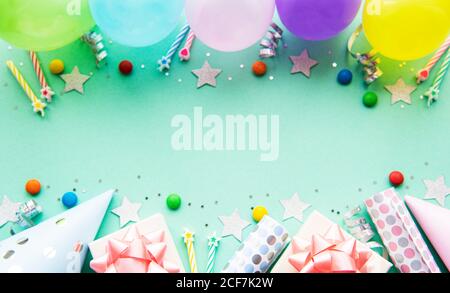 Birthday decorations with pastel balloons on white background Stock Photo -  Alamy