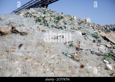 Bucharest, Romania - September 1, 2020: Empty bottles are piled up in a glass recycling facility. Stock Photo