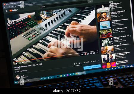 Watching a YouTube video on a PC computer monitor by streaming video over the Internet Stock Photo