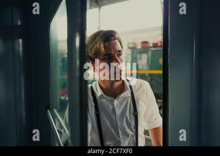 Traveler looking out train window Stock Photo