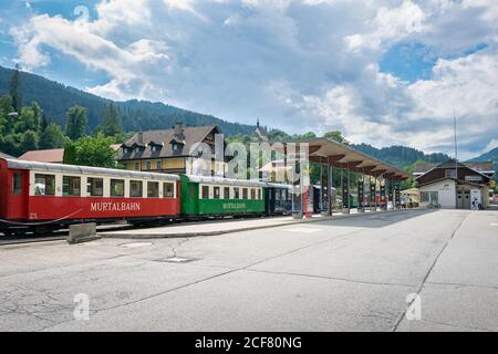Train station of the town of Murau in state Steiermark, Austria. Touristic train 'Murtalbahn' is waiting at the station. Stock Photo