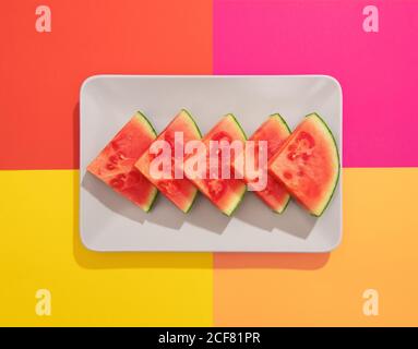 Summer juicy fruit watermelon in colorful background from above