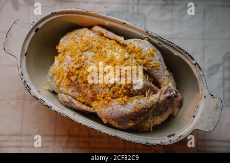 Raw chicken with orange zest prepared for home dinner Stock Photo