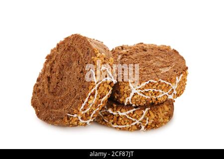 Slices of sweet chocolate roll cake isolated on white background Stock Photo
