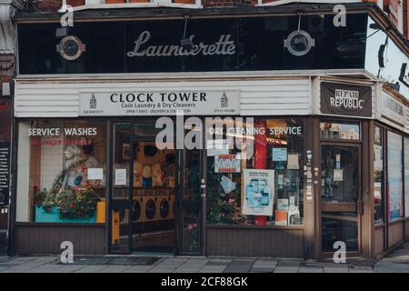 London, UK - August 20, 2020: Exterior of Clock Tower launderette and dry cleaners in Crouch End, an area in North London traditionally favoured by cr Stock Photo