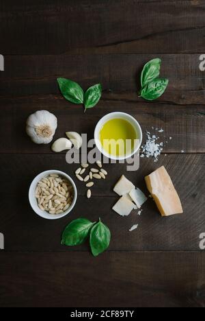 Ingredients for pesto pasta arranged at table Stock Photo