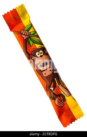 individual Fruit-tella zoomania zoo mania chewy sweet candy with fruit juice removed from packet showing monkey chimp ape isolated on white background Stock Photo