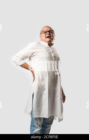 Indian asian old man having pain or ache in different body parts, sad expressions Stock Photo