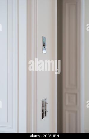 Metal switch on white wall in room with trendy minimalist interior Stock Photo