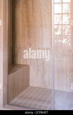 Stylish shower cabin from glass and with marble tile in contemporary house Stock Photo