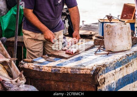 Fisherman stand at the Essaouira port in Morocco. Stock Photo