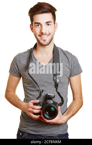 Young smiling man holds a camera with radio trigger as a photographer Stock Photo
