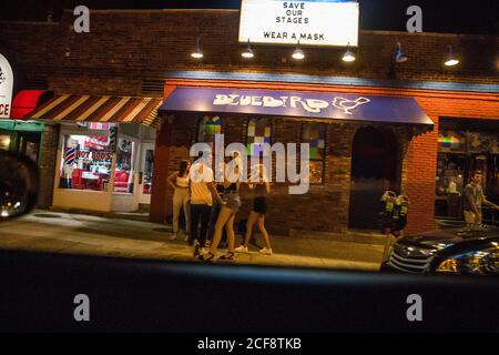 Bloomington, United States. 20th Aug, 2020. Unmasked patrons gather outside the Bluebird nightclub a week before Indiana University classes started during the Coronavirus pandemic.Over 30 Greek houses at Indiana University are currently under quarantine. Credit: SOPA Images Limited/Alamy Live News Stock Photo