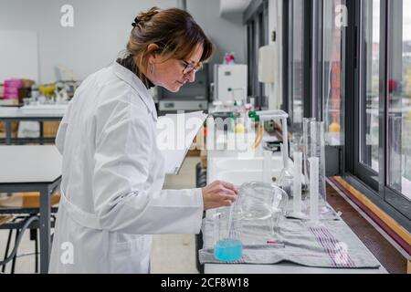 Adult Woman working in chemistry lab Stock Photo
